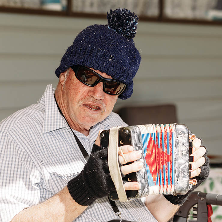 Waminda client playing button accordion